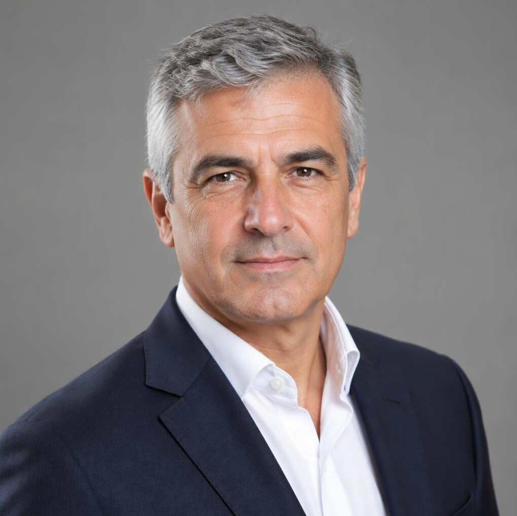 Studio portrait of an older Portuguese man with grey hair